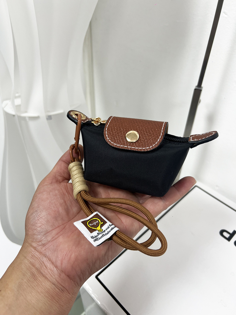 2025S New Model Super Mini Dumpg Bun New French Nylon Leather Change Earphones Lipstick Key Small Pendant Bag
