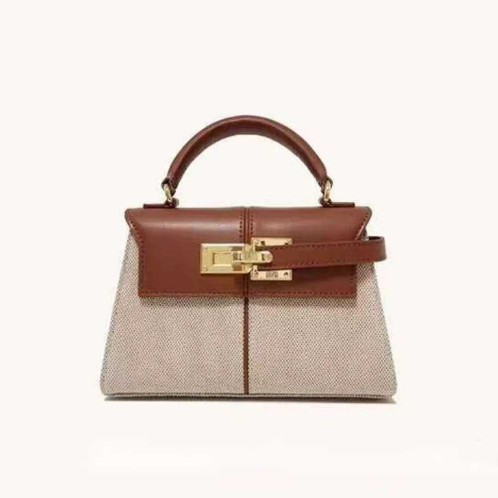 2025 JW PEI Trapezoidal Leather Womens Bag hot Versatile Crossbody Fashionable Niche Handbag Top-handle Bags C250401
