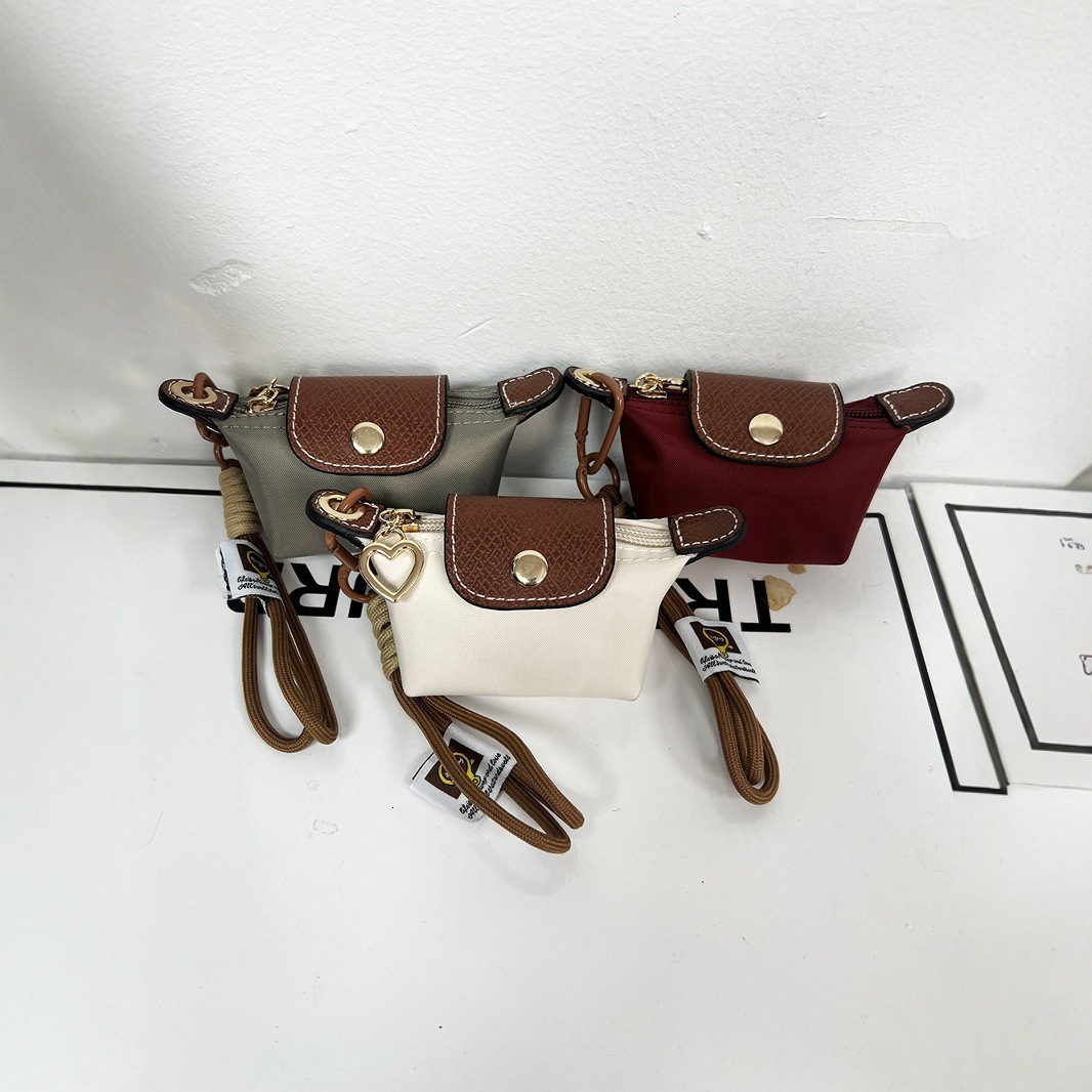 2025S New Model Super Mini Dumpg Bun New French Nylon Leather Change Earphones Lipstick Key Small Pendant Bag