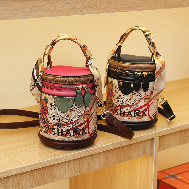 Free shipping bucket bag Women's new women's temperament graffiti cylindrical everything stylish single shoulder crossbody bag