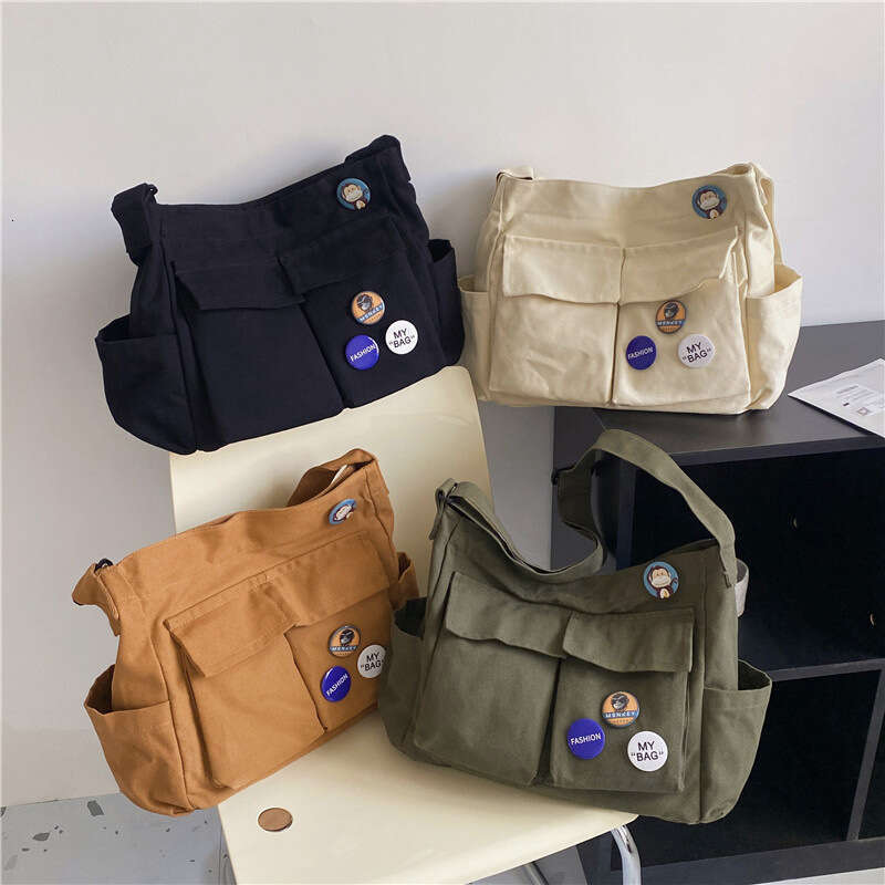 2025 NEW Work style single shoulder crossbody men and women ins canvas for students, school bag, street large capacity artistic leisure bag