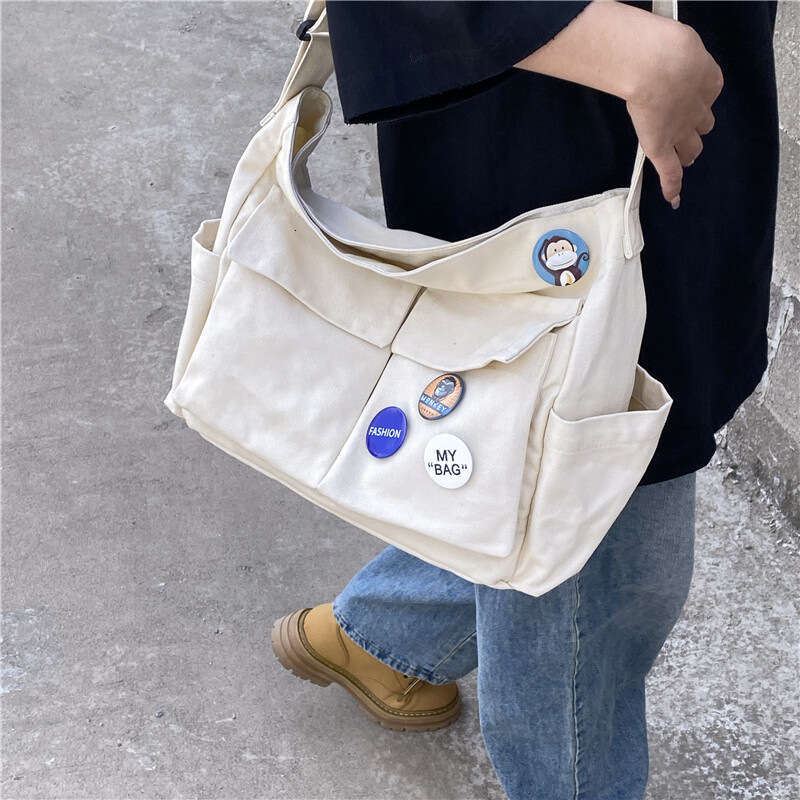 2025 NEW Work style single shoulder crossbody men and women ins canvas for students, school bag, street large capacity artistic leisure bag