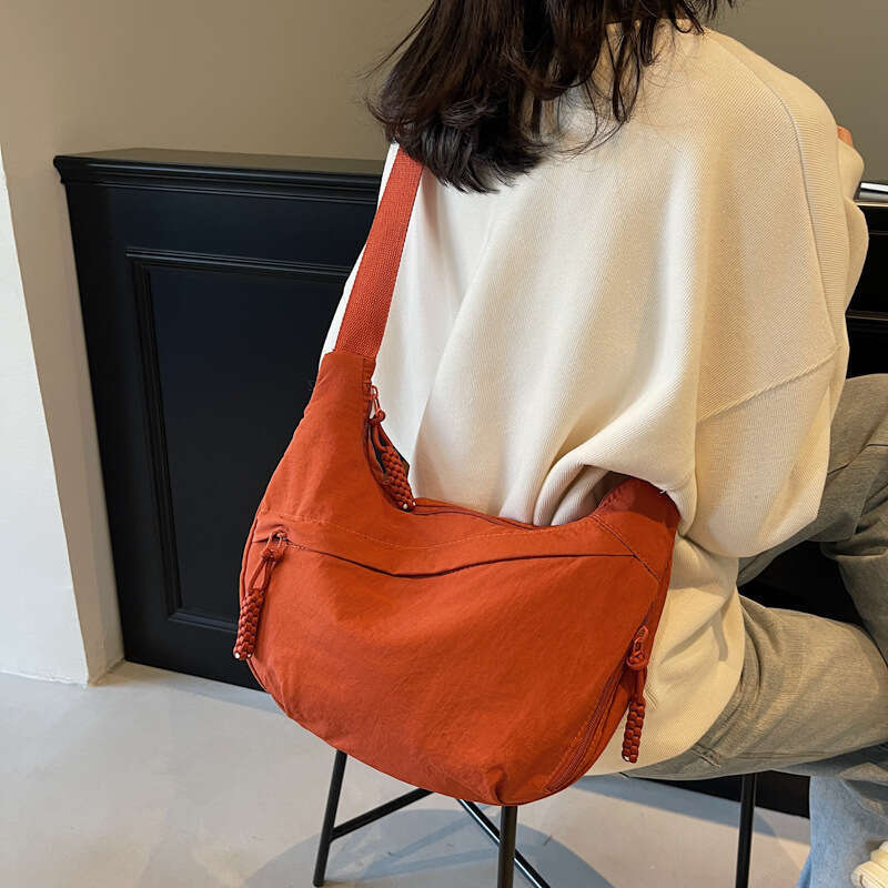 2025 NEW Female student fashion class crossbody nylon cloth large capacity shoulder solid color simple and versatile travel dumpling bag