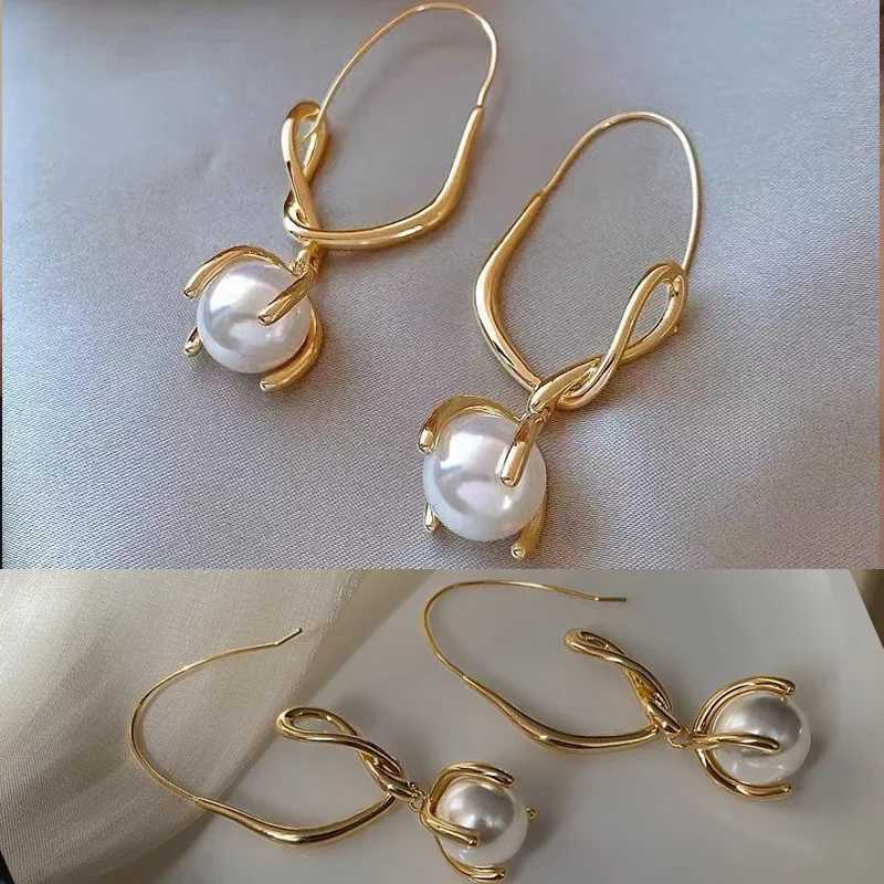 Metal twisted wire retro imitation pearl earrings fashionable and elegant pendant earrings luxurious design womens jewelry accessories Y250401