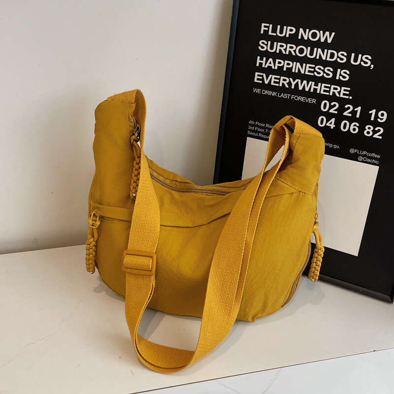 2025 NEW Female student fashion class crossbody nylon cloth large capacity shoulder solid color simple and versatile travel dumpling bag