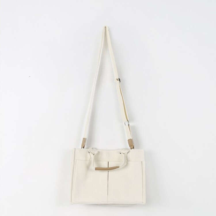 2025 NEW Canvas for women, Korean version, simple and fashionable handbag, ins, artistic style, multiple pockets, women's personalized one should