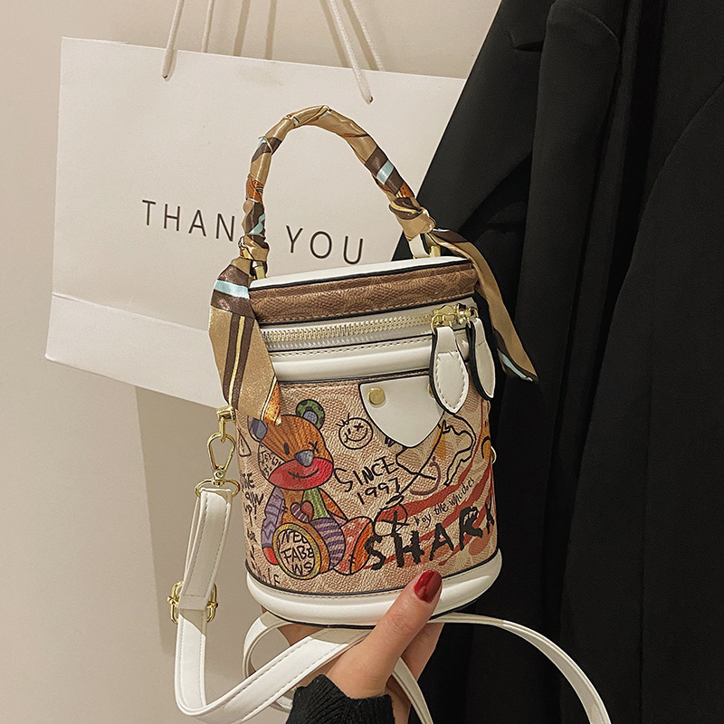 Free shipping bucket bag Women's new women's temperament graffiti cylindrical everything stylish single shoulder crossbody bag