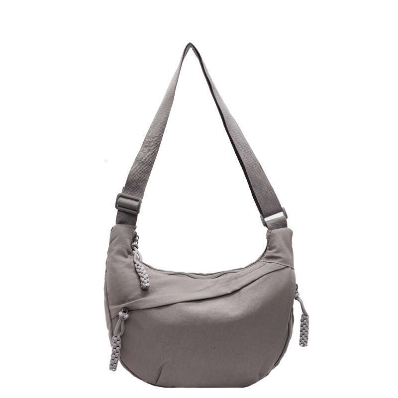 2025 NEW Female student fashion class crossbody nylon cloth large capacity shoulder solid color simple and versatile travel dumpling bag