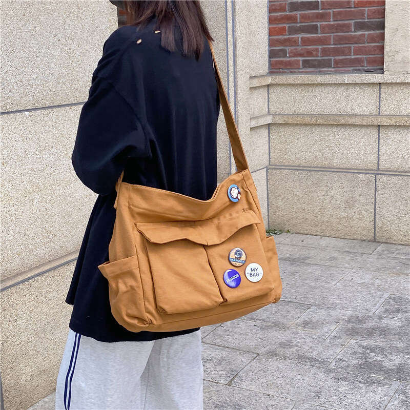 2025 NEW Work style single shoulder crossbody men and women ins canvas for students, school bag, street large capacity artistic leisure bag