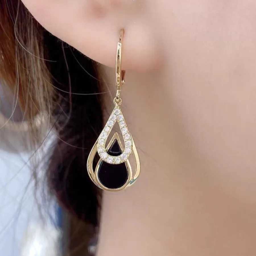 Fashionable rhinestone black enamel oil drop pendant earrings suitable for womens parties gold hollow circular jewelry gift Y250401