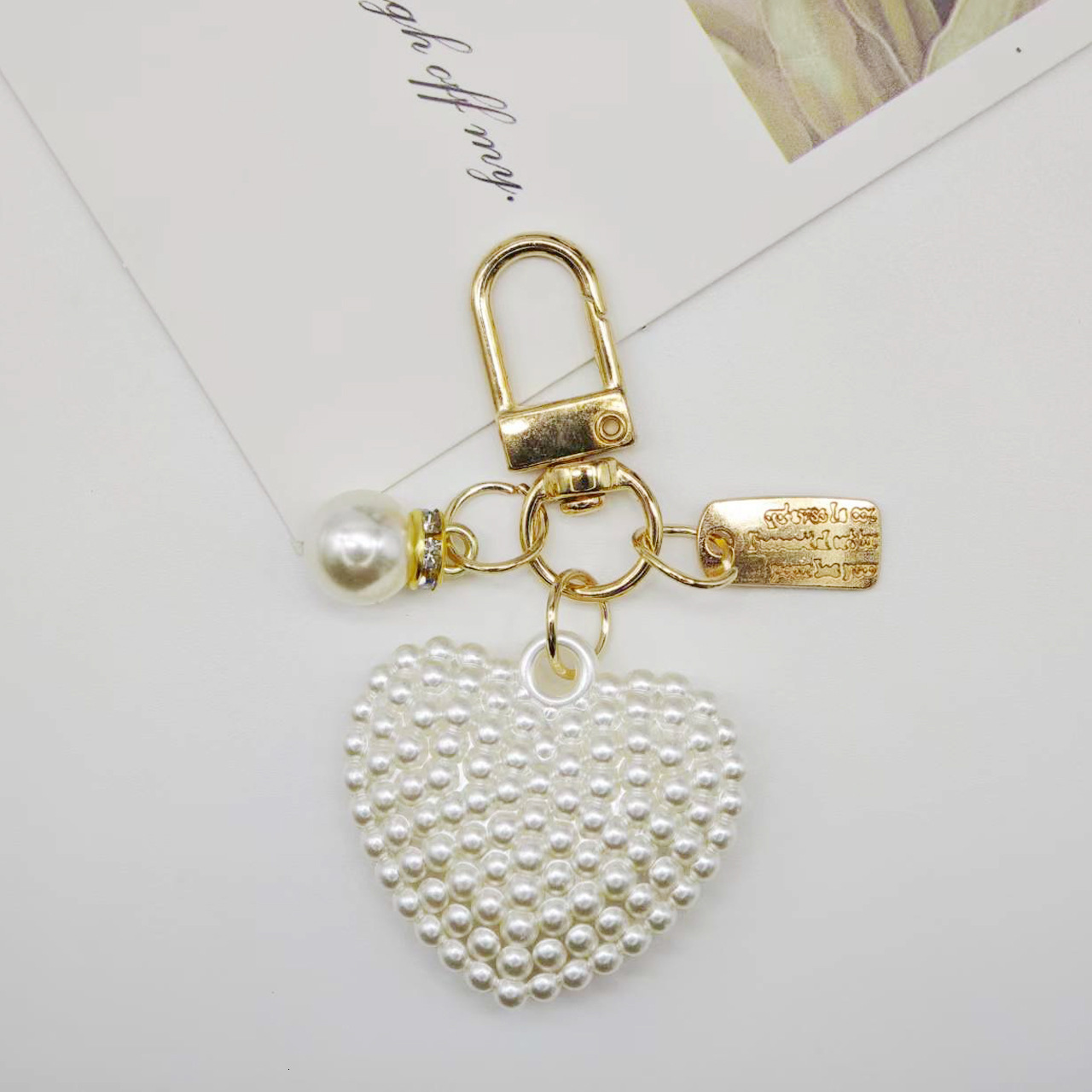 designer bag charm New Pearl Alloy Keychain Creative Hollow Heart Nameplate Accessories Earphone Case Bag Decoration Pendant keychain designer