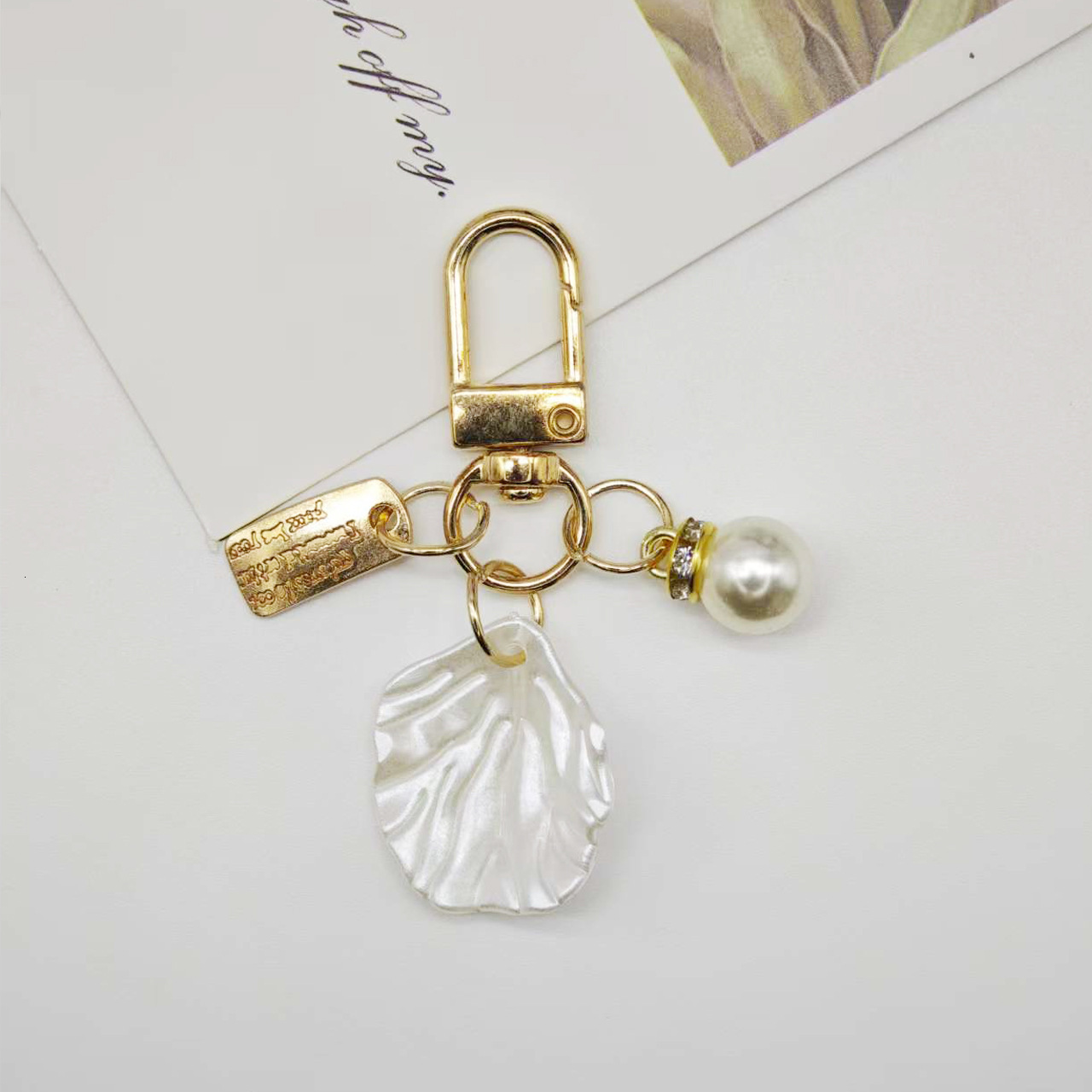 designer bag charm New Pearl Alloy Keychain Creative Hollow Heart Nameplate Accessories Earphone Case Bag Decoration Pendant keychain designer