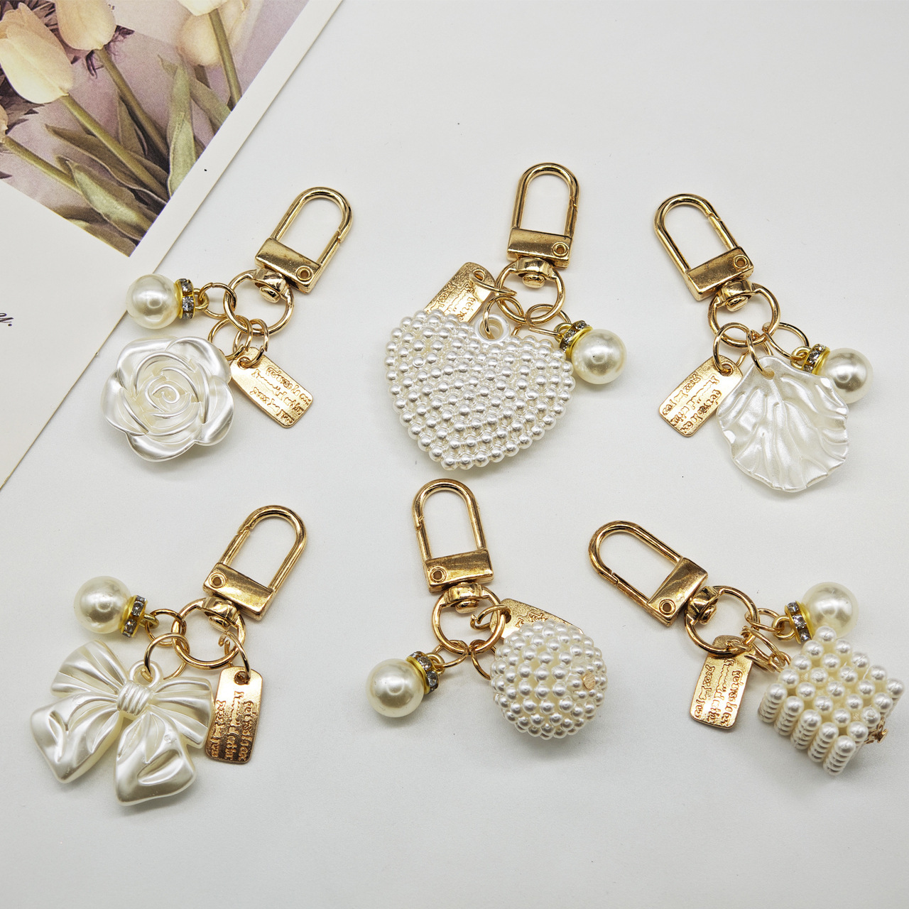 designer bag charm New Pearl Alloy Keychain Creative Hollow Heart Nameplate Accessories Earphone Case Bag Decoration Pendant keychain designer