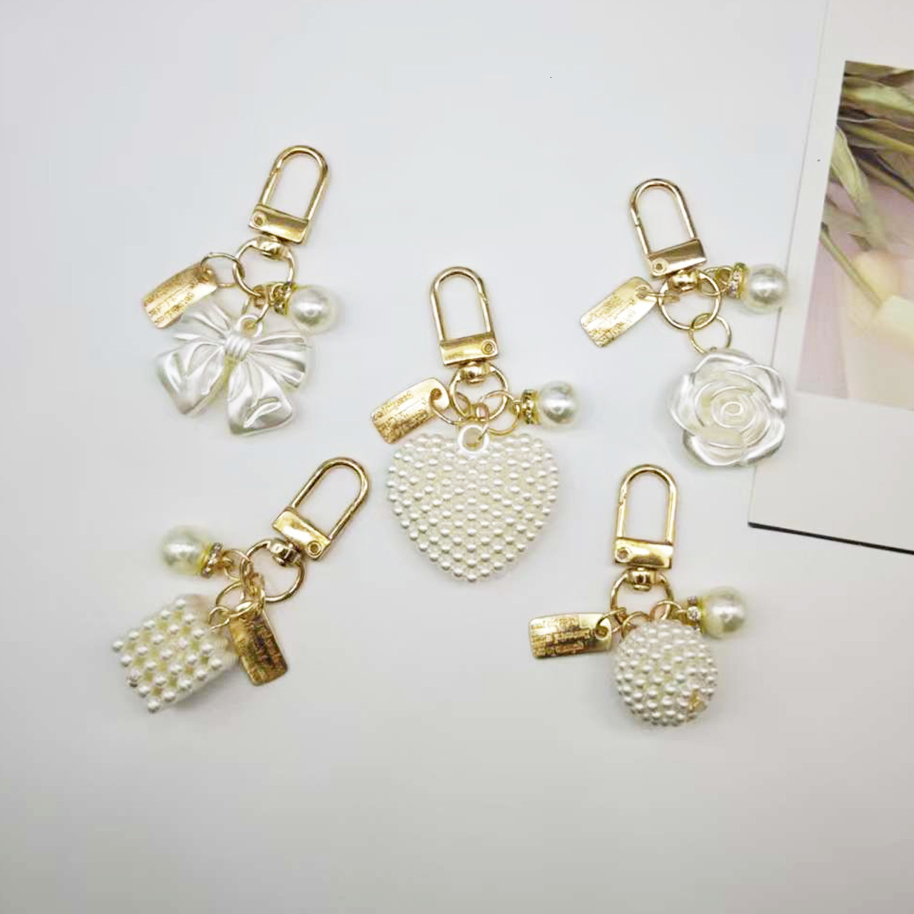 designer bag charm New Pearl Alloy Keychain Creative Hollow Heart Nameplate Accessories Earphone Case Bag Decoration Pendant keychain designer