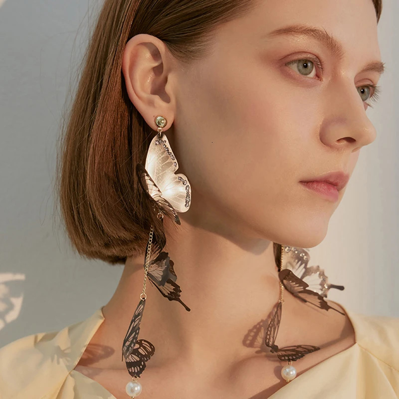 Black hollow butterfly pendant earrings long tassel suitable for women to elegantly pearl drop temperature jewelry 250326