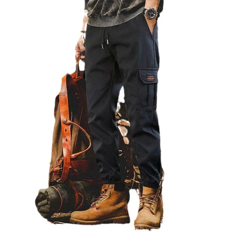 Loose fitting multi pocket jogging pants suitable for mens street style in spring and summer with elongated waist casual outdoor sports cargo p 250403