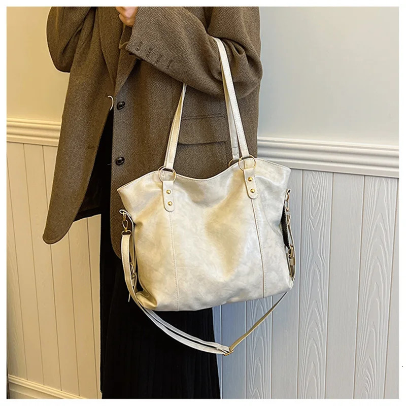 Large capacity womens shoulder bag fashionable homeless shopping bag solid color soft leather cross body handbag womens travel handbag 250402