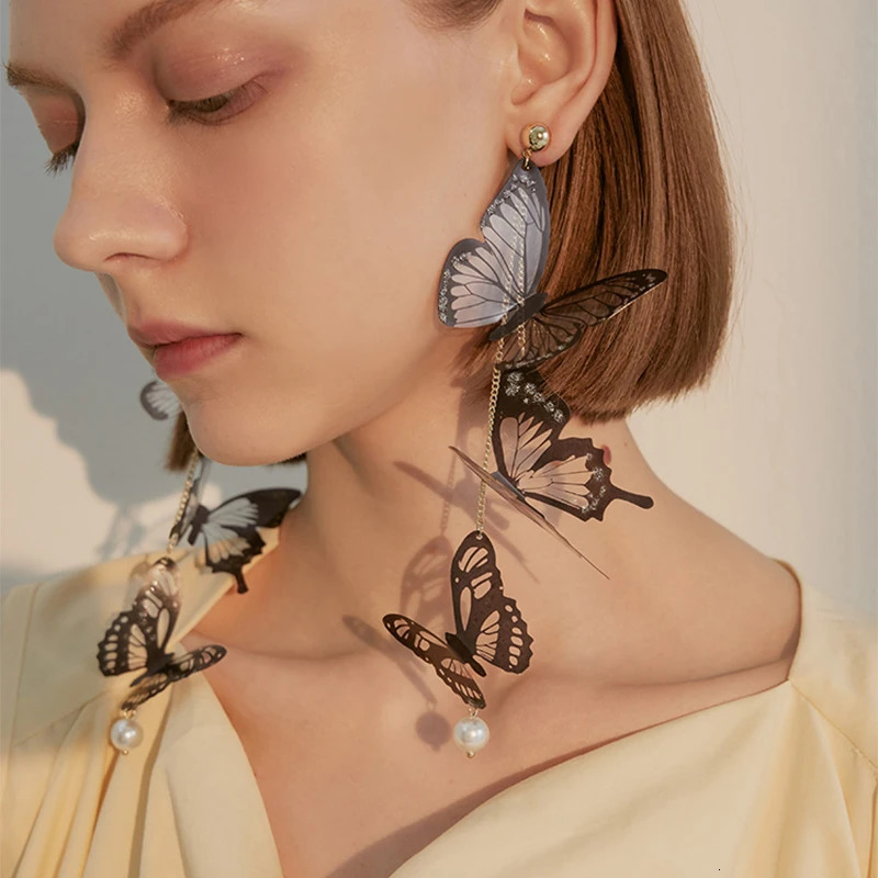 Black hollow butterfly pendant earrings long tassel suitable for women to elegantly pearl drop temperature jewelry 250326