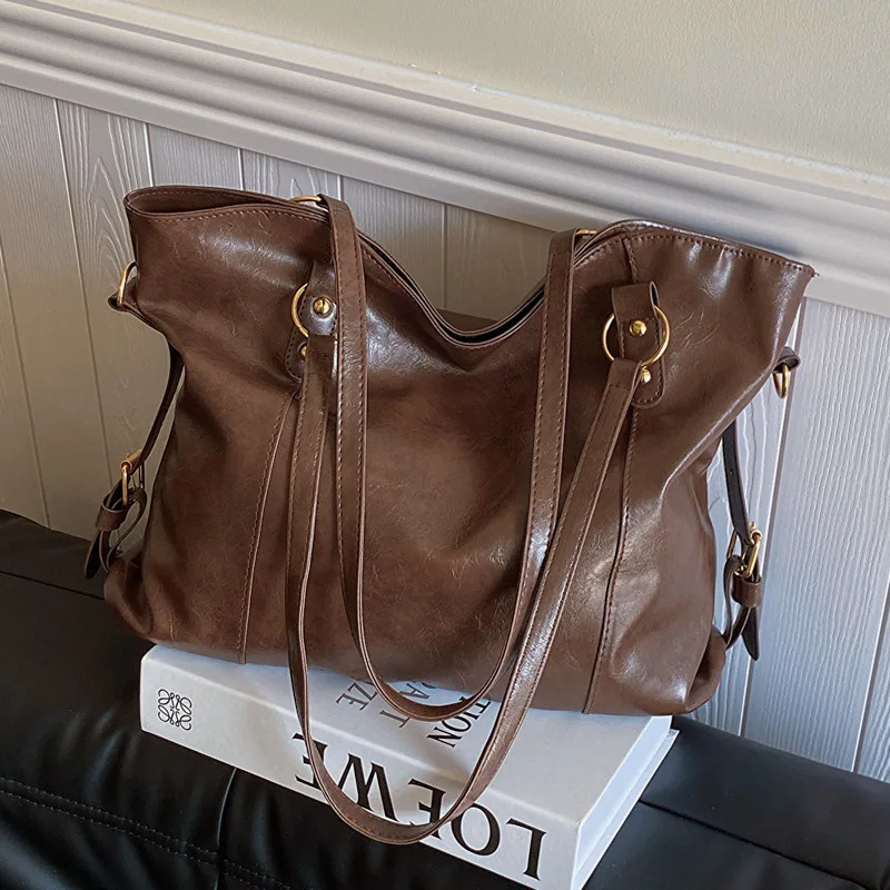 Large capacity womens shoulder bag fashionable homeless shopping bag solid color soft leather cross body handbag womens travel handbag 250402