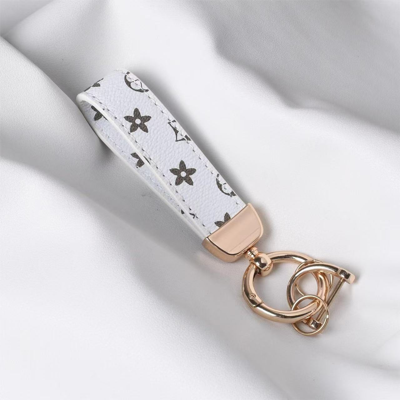 Unisex designer new floral leather wrist keychain, car key chain with 2 key rings and anti-lost D-ring, women's keyring wristband