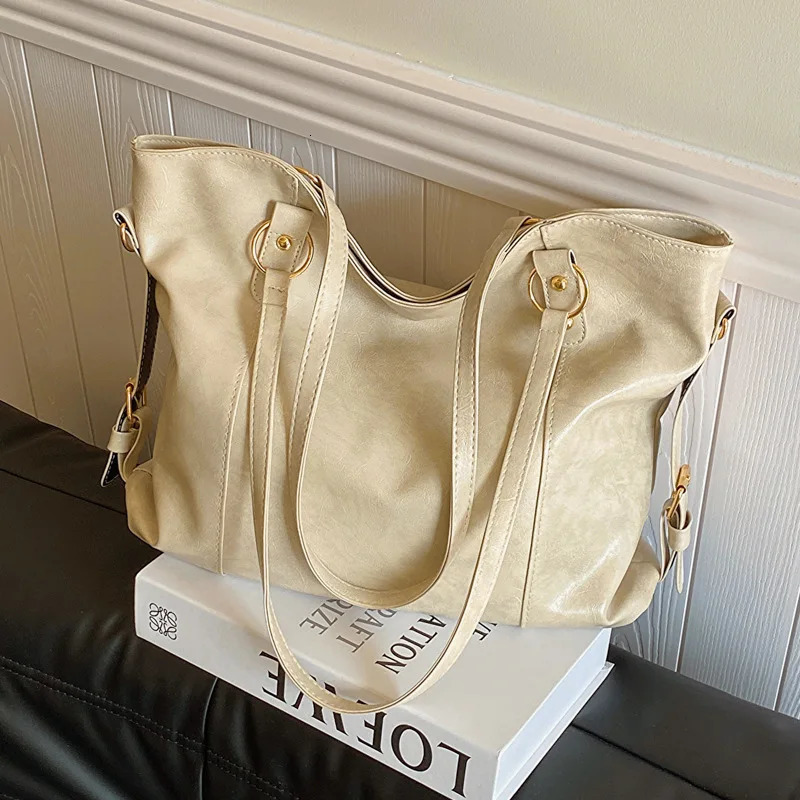 Large capacity womens shoulder bag fashionable homeless shopping bag solid color soft leather cross body handbag womens travel handbag 250402