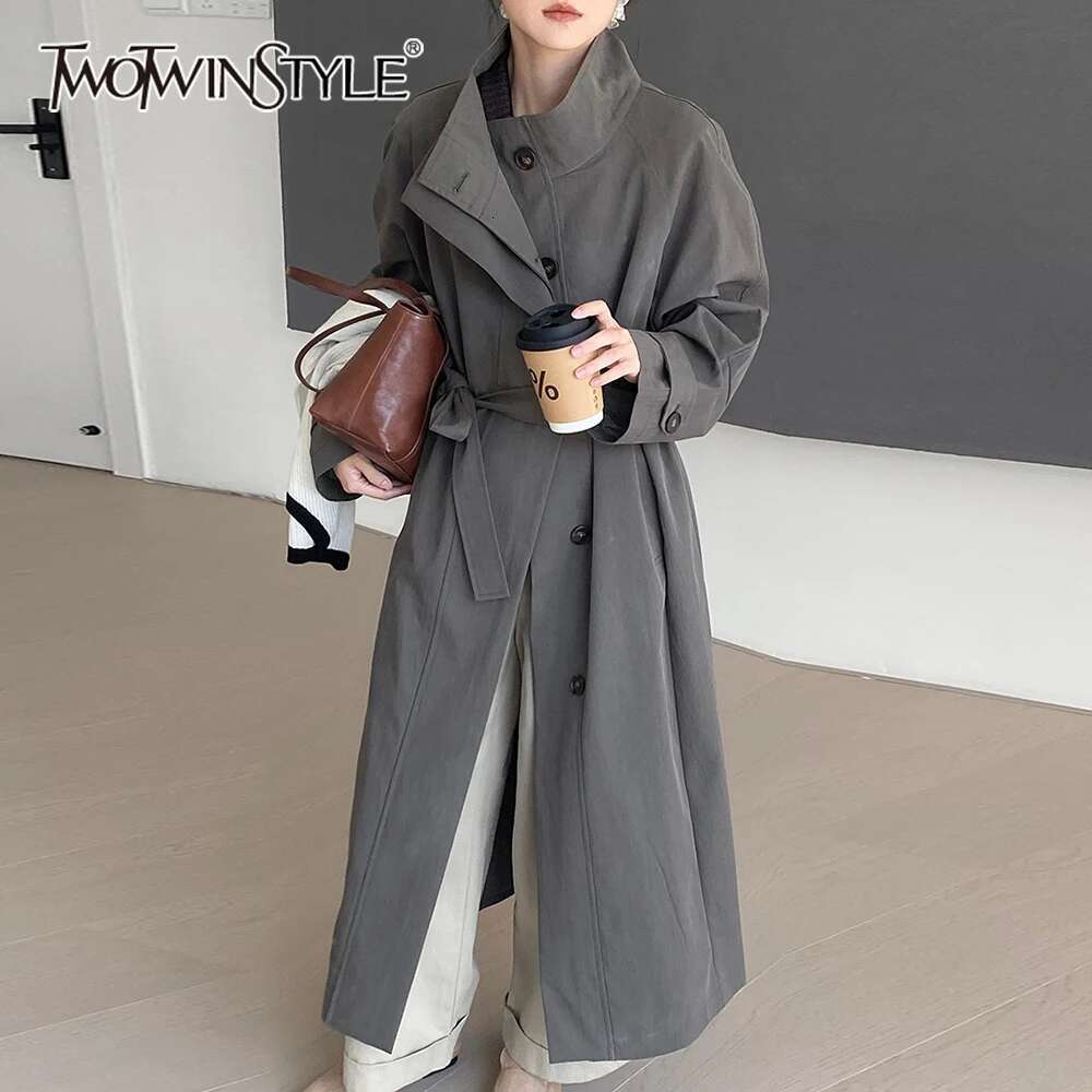 TWOTWINSTYLE Solid Casual Patchwork Lace Up Trench For Women Stand Collar Long Sleeve Spliced Button Loose Overcoat Female New