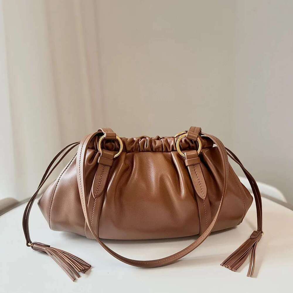 Women's Bags Women's Bags High new retro jiaozi bags soft real leather pleated tassel baguette hand bill of lading shoulder Women's bag
