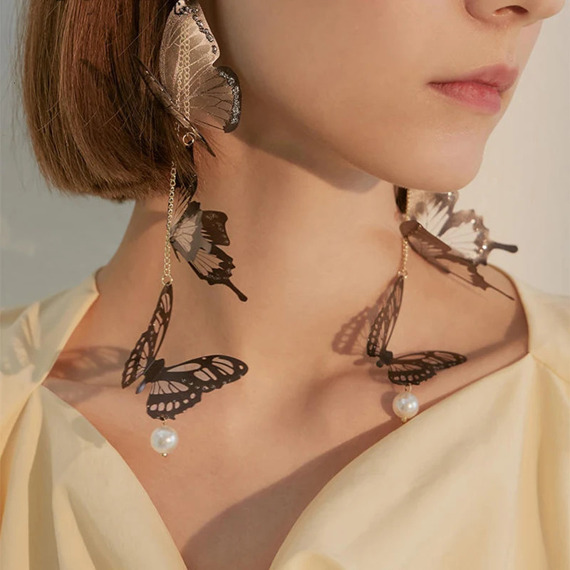 Black hollow butterfly pendant earrings long tassel suitable for women to elegantly pearl drop temperature jewelry 250326