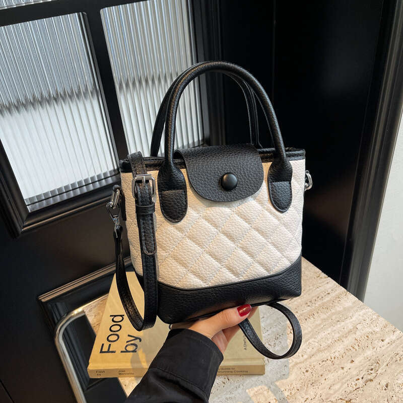 Korean version of niche hand-held bucket for women's spring new fashion versatile and high-end single shoulder crossbody bag