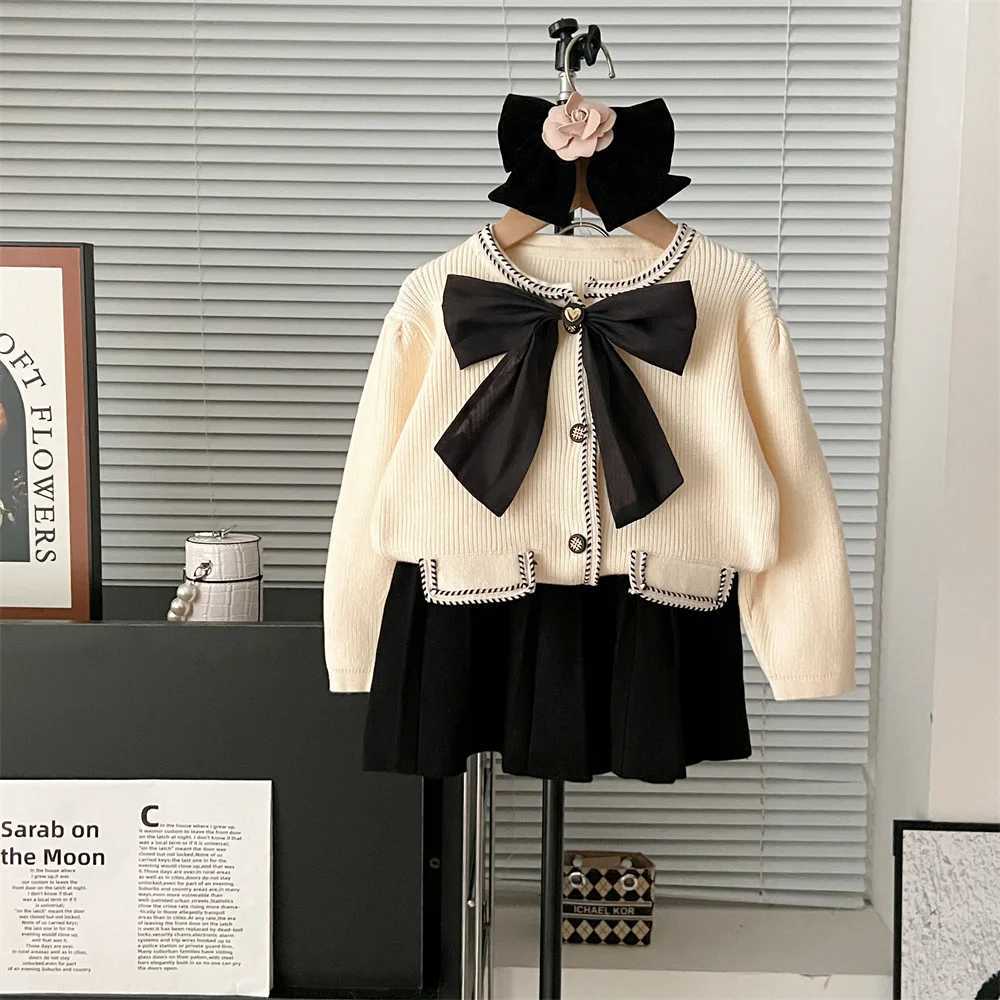 Autumn and Winter Girls Sweater Sets Campus Big Bow Knot Knitted Bubble Sleeve Cardigan Sweaterversatile Pleated Skirt 2pcs Y251105
