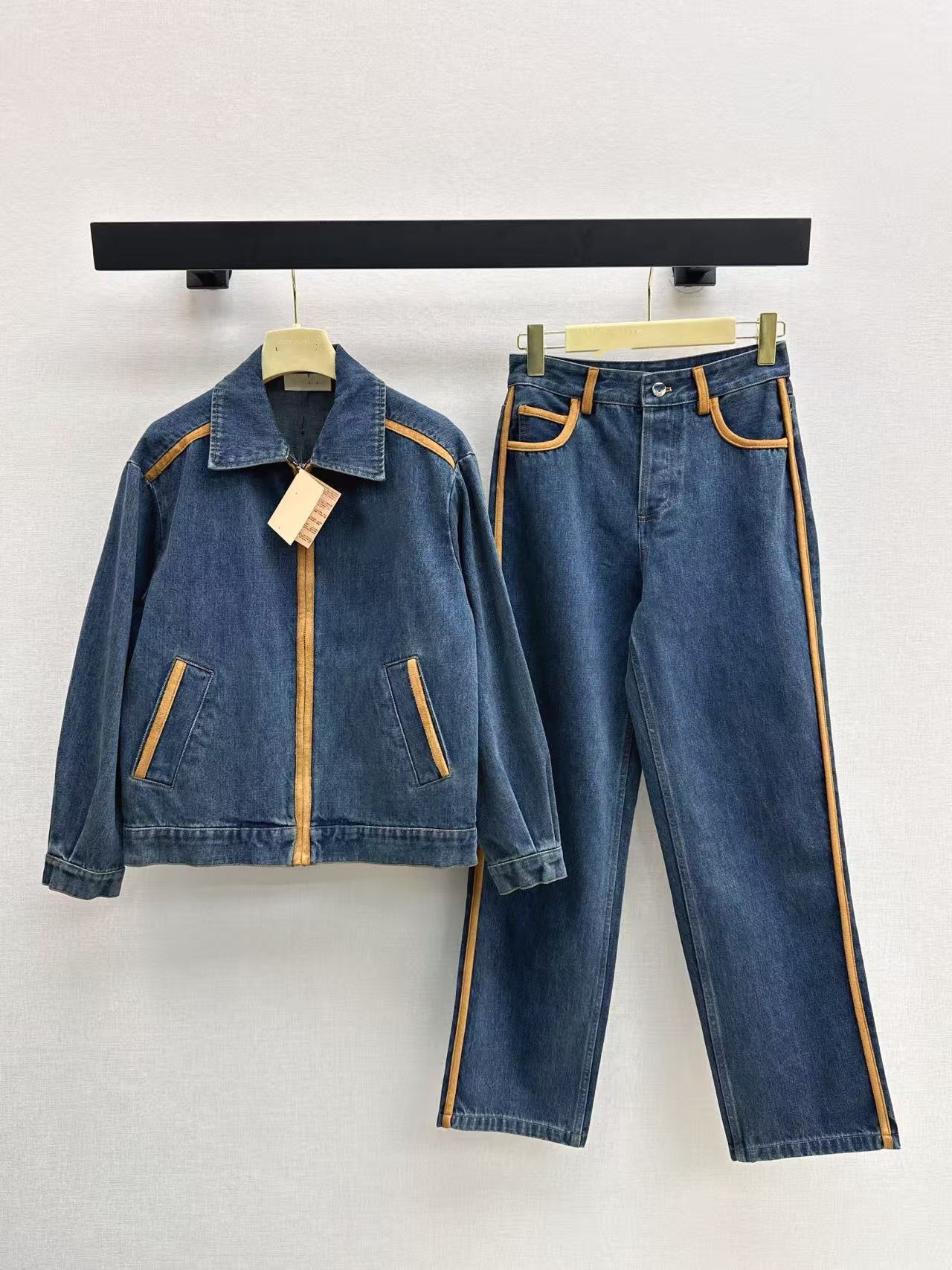 New style streetwear denim jacket with leather patch decoration and dropped shoulders.