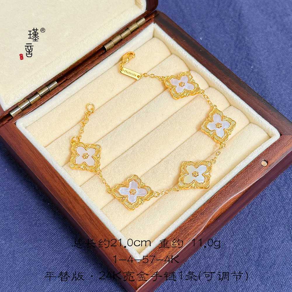 Gold Shop 24K real gold lucky grass ins niche design high-end au999 real gold new shell hand jewelry C251105
