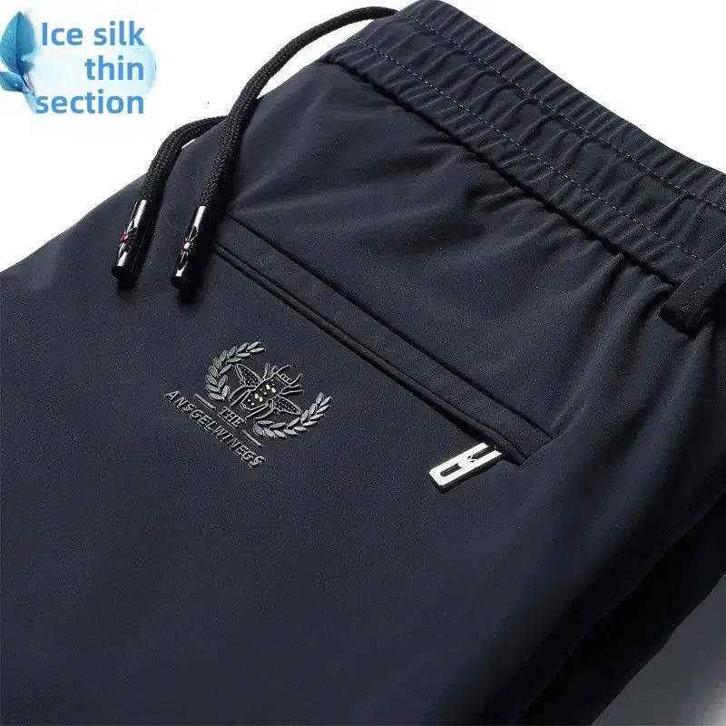 Mens casual elastic waist sports pants with loose fit for business travelers ice silk spring and summer slim mens sports pants 250402