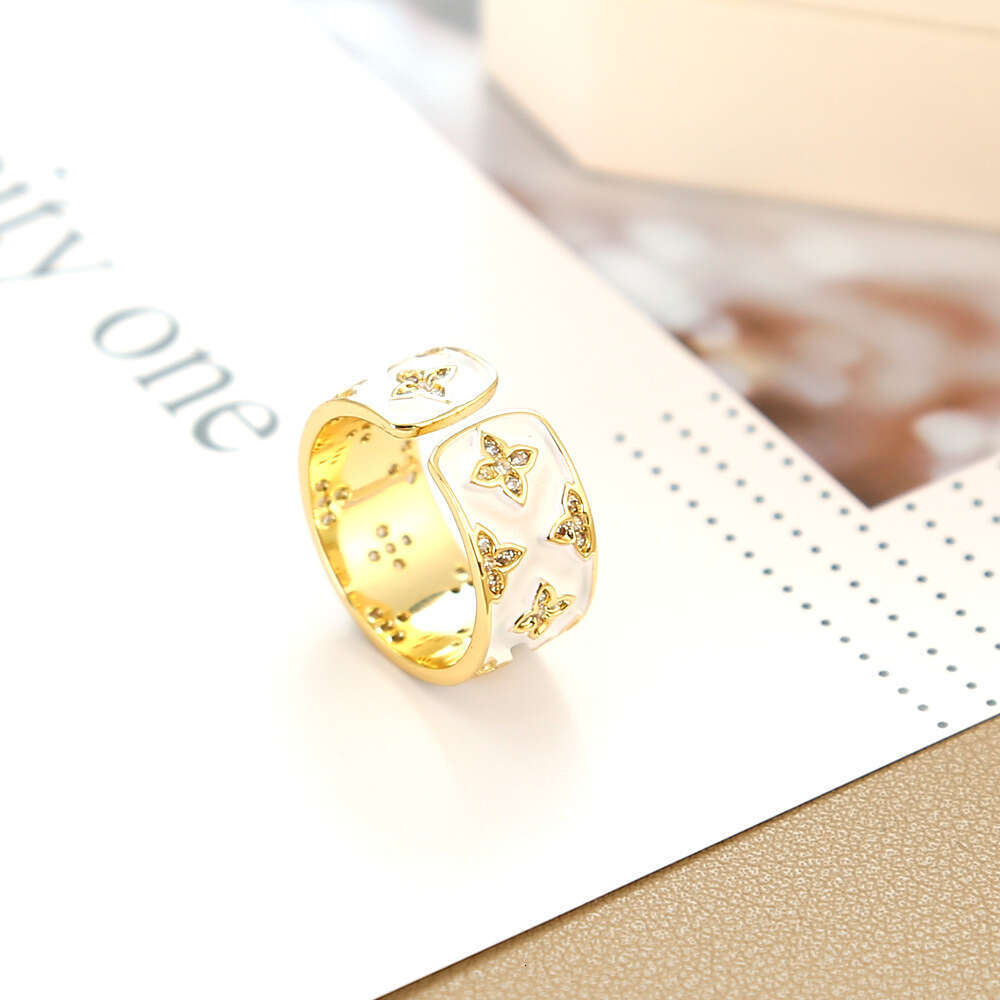 New White Enamel Four-Leaf Flower for Women, Niche Design, High-End Feel, Internet Celebrity Versatile Light Luxury Index Finger Ring Jewelry