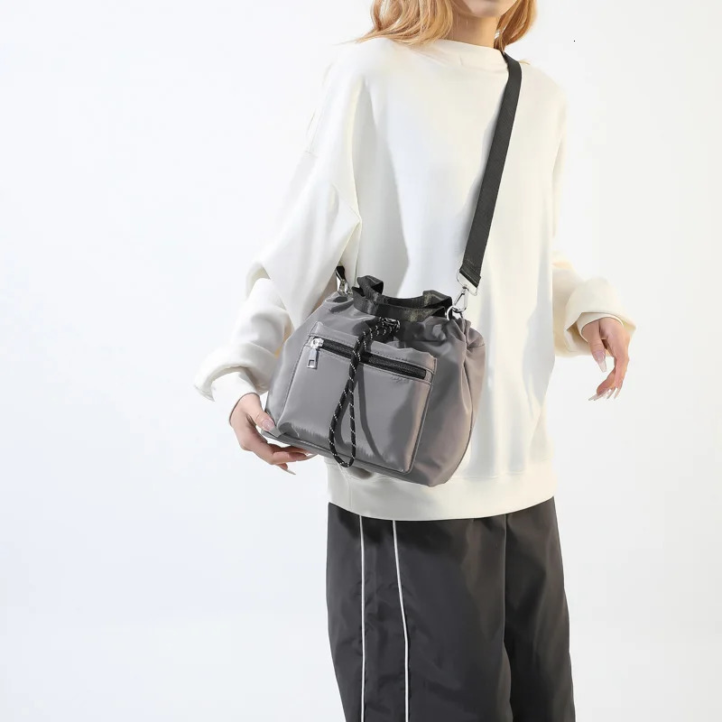 1 solid color womens shoulder bag Versatile handheld crossbody fashionable bucket can accommodate mobile phones 250401