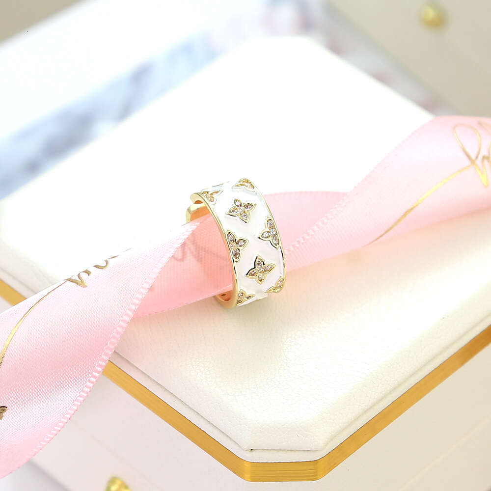 New White Enamel Four-Leaf Flower for Women, Niche Design, High-End Feel, Internet Celebrity Versatile Light Luxury Index Finger Ring Jewelry