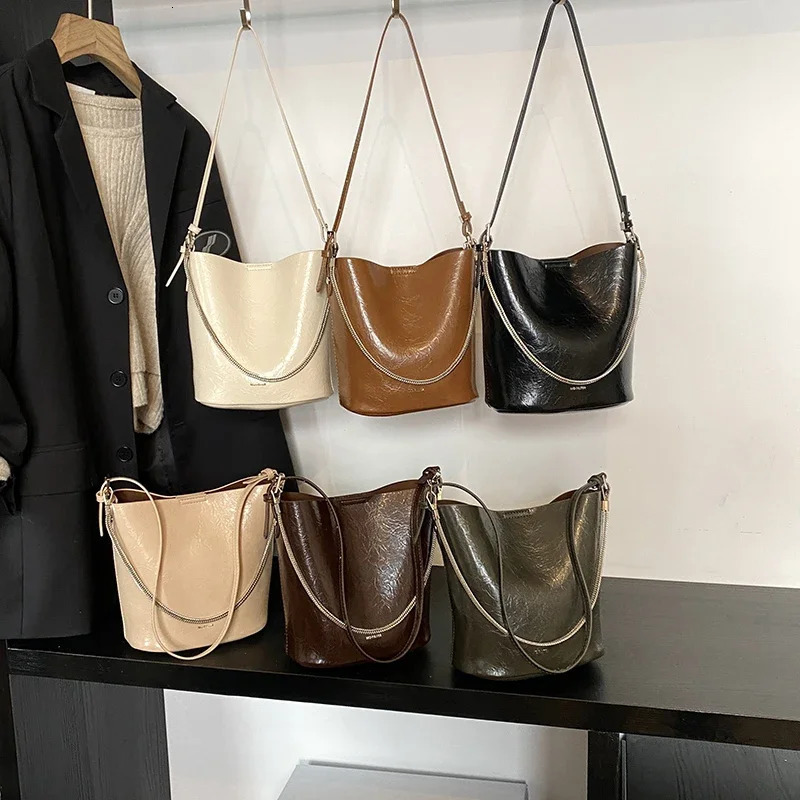 Product Chain Simple PU Bucket Womens Handbag Large Capacity Trendy Fashion Solid Color Trendy Buckle Shoulder Bag 251104