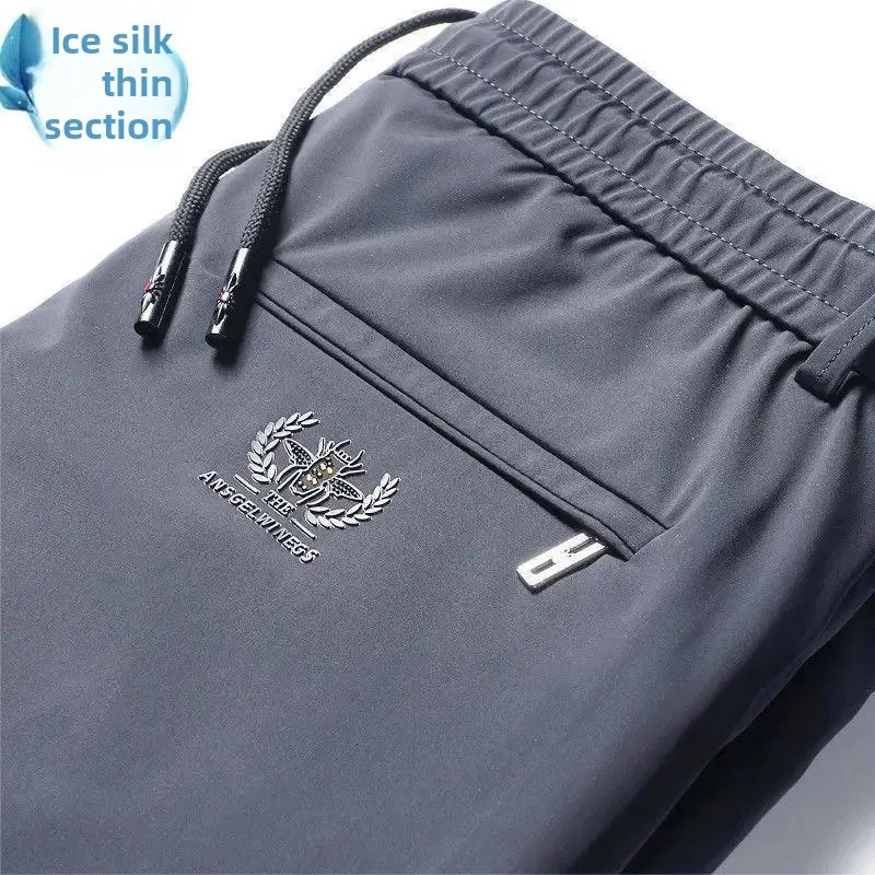 Mens casual elastic waist sports pants with loose fit for business travelers ice silk spring and summer slim mens sports pants 250402