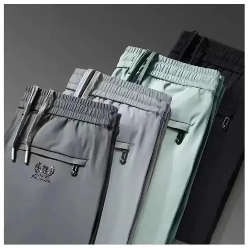 Mens casual elastic waist sports pants with loose fit for business travelers ice silk spring and summer slim mens sports pants 250402