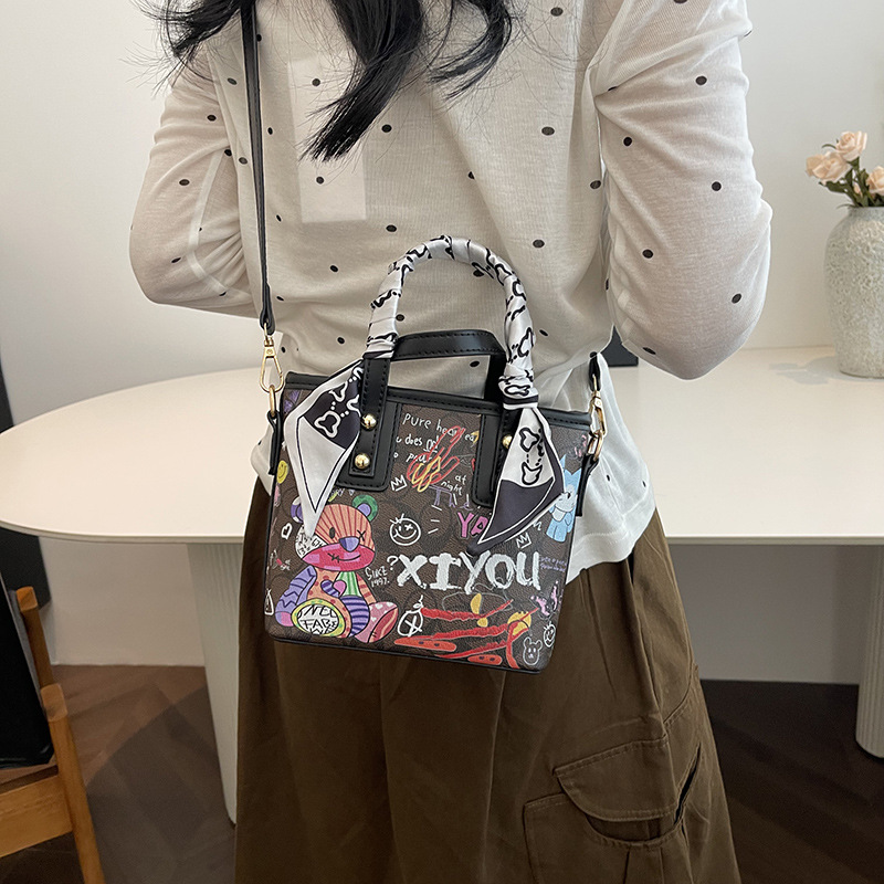 Free shipping small bag women's new painted graffiti fashion hand basket bag artistic texture crossbody bag