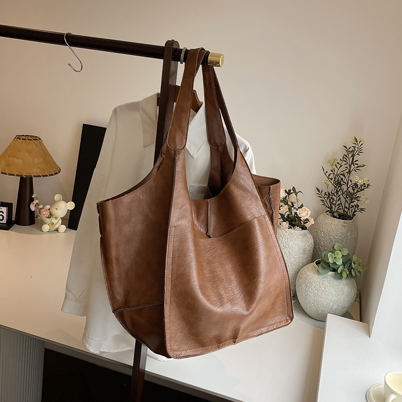 2025S Designer Women S Bag Minimalist New Underarm Soft Leather Large Capacity Shoulder Handheld Solid Color Versatile Tote Bag