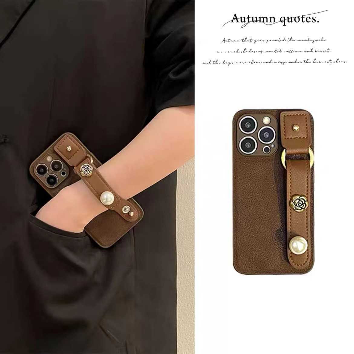 Suitable for 17 Pro Max Phone Case Pearl Camellia Wrist Strap iPhone 16 Protective Cover 15 New Luxury J251202
