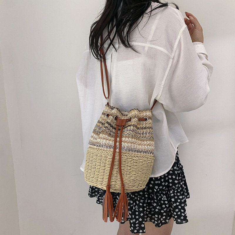 2025S Designer Women S Bag Instagram Bucket Women S Drawstring Single Shoulder Striped Woven Bag Vacation Beach Crossbody Handbag Large Bag