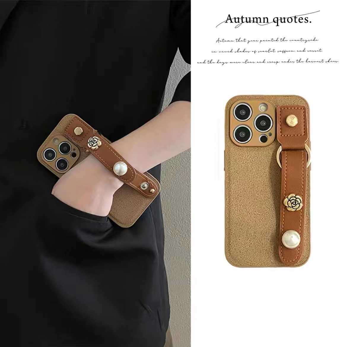Suitable for 17 Pro Max Phone Case Pearl Camellia Wrist Strap iPhone 16 Protective Cover 15 New Luxury J251202