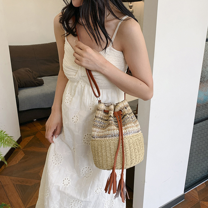 2025S Designer Women S Bag Instagram Bucket Women S Drawstring Single Shoulder Striped Woven Bag Vacation Beach Crossbody Handbag Large Bag
