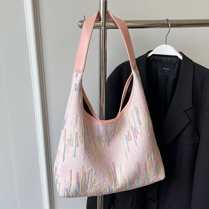 2025S Designer Women S Bag Small Niche Design Canvas Women S Summer Large Capacity New Versatile Armpit Bag High End Single Shoulder Bag