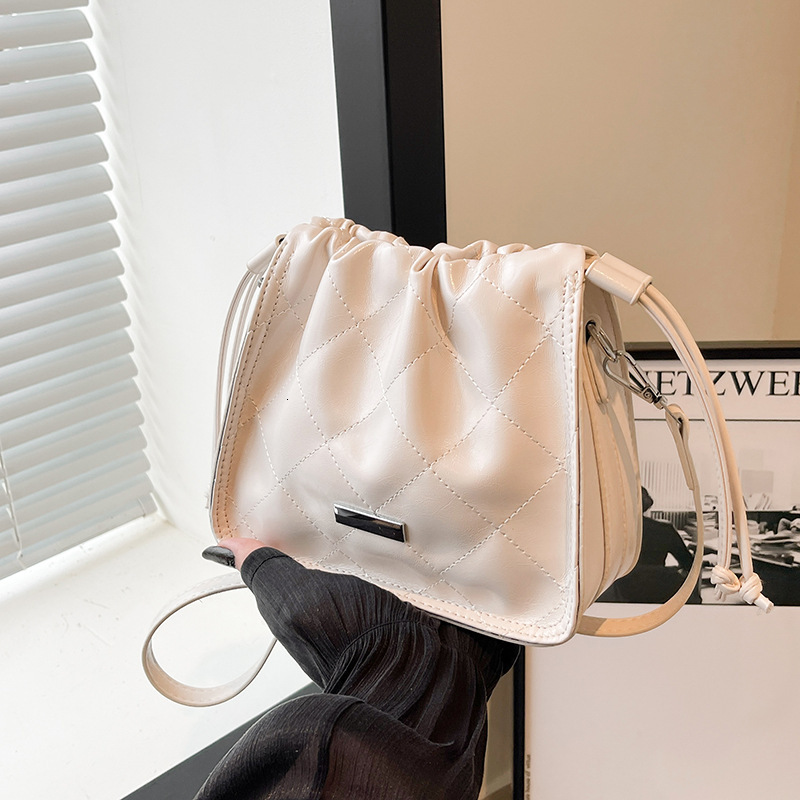 2025S Designer Women S Bag Summer New Women S Diamond Grid Embroidery Thread Drawstring Versatile Bucket With Niche Design Single Shoulder Crossbody B