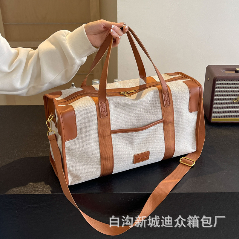 2025S Designer Women S Bag Large Capacity Hand Held Short Distance Women S Lightweight Luggage Bag Men S Leisure Travel Storage Commuting Business Tri