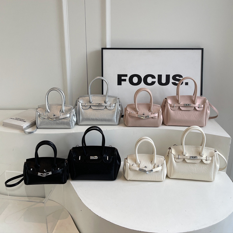2025S Designer Women S Bag Korean Fashion Handheld Women S Bag Summer New Collection Simple Texture Single Shoulder Kelly Bag Niche Design Diagonal Cr