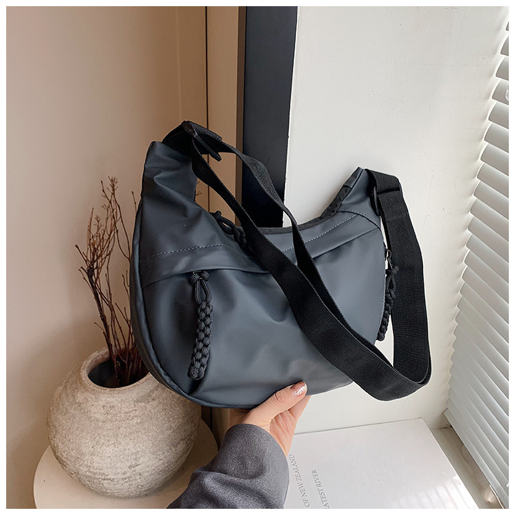 2025S Designer Women S Bag Workwear Style Women S Shoulder Oxford Cloth Ins Canvas Street Large Capacity Artistic Leisure Travel Dumpling Bag